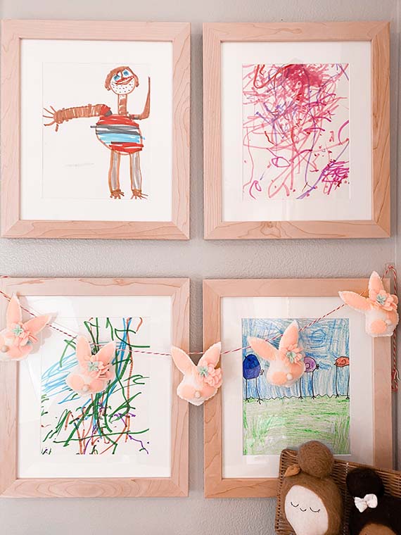 framed children's art on the wall