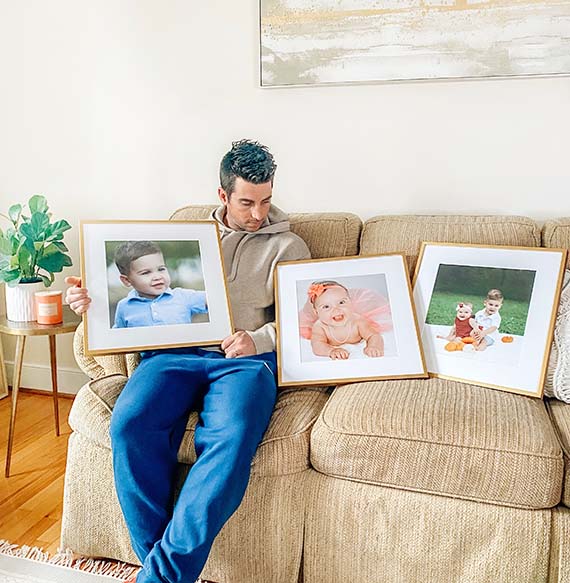 person sitting behind frames