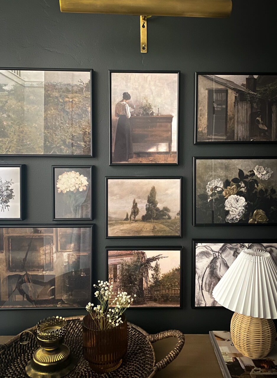 dark wall with gallery wall of black picture frames