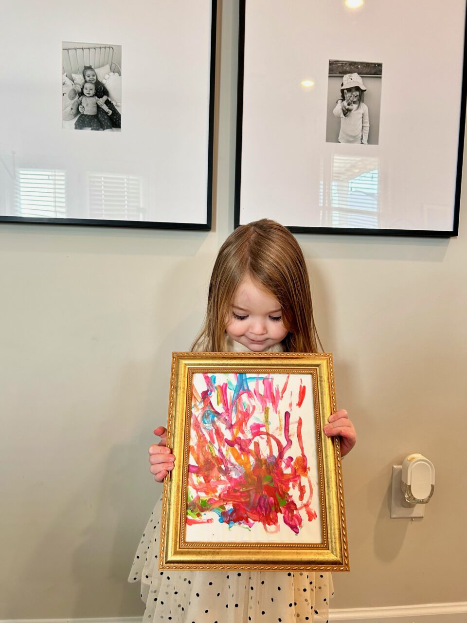 gold picture frame with kid art