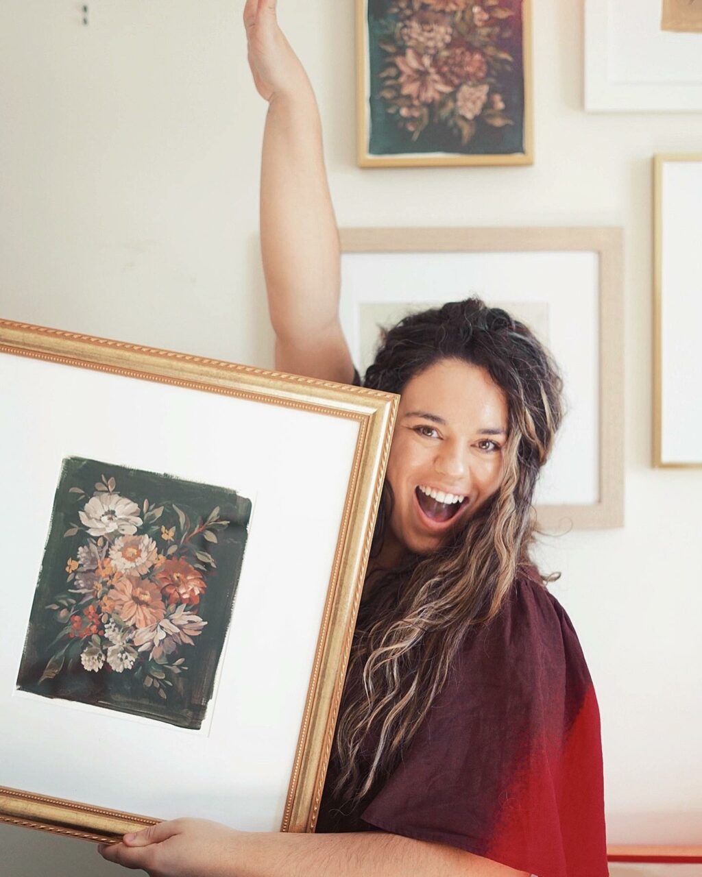 Artists holding a framed art print