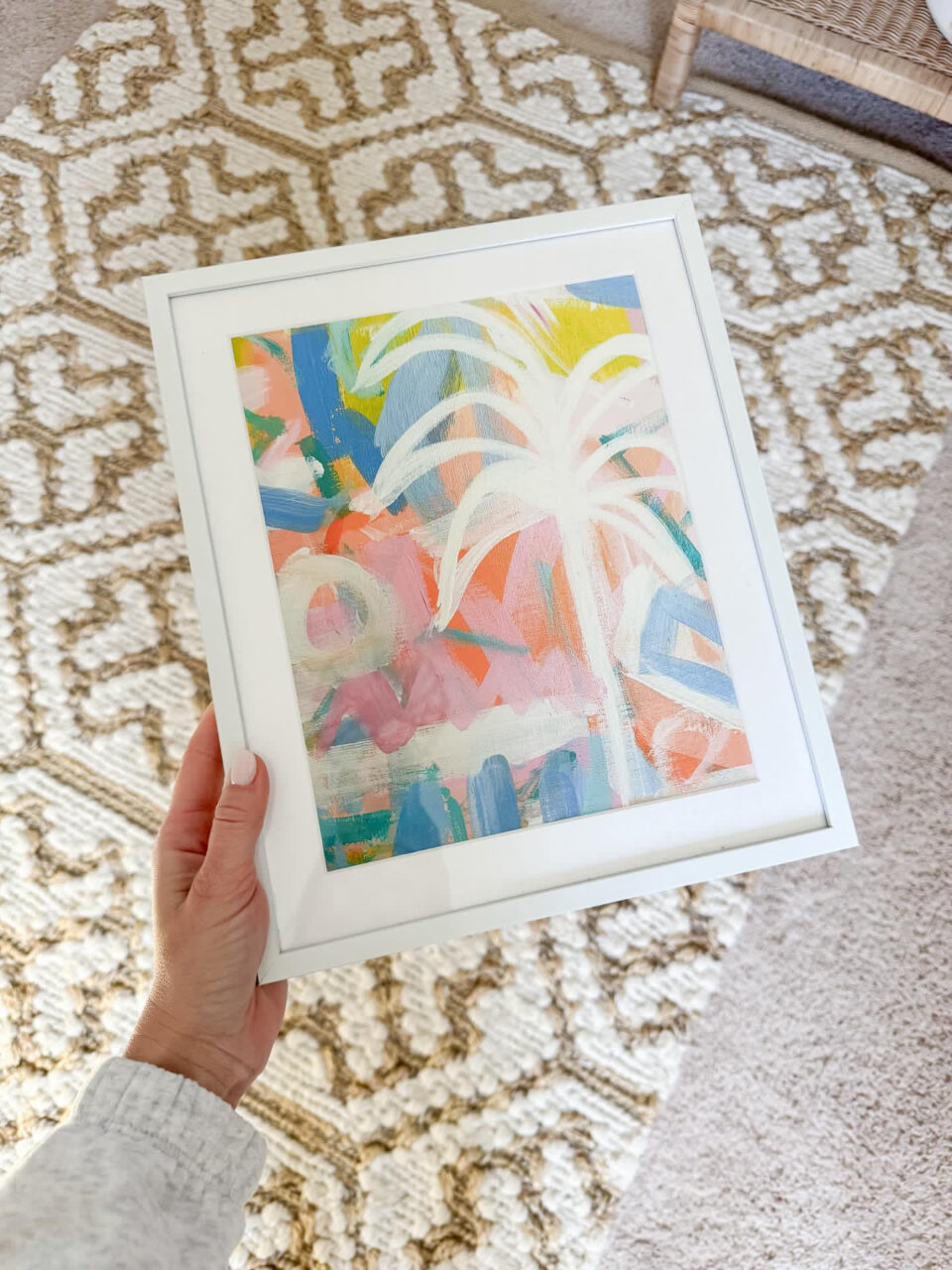 colorful art in a white frame