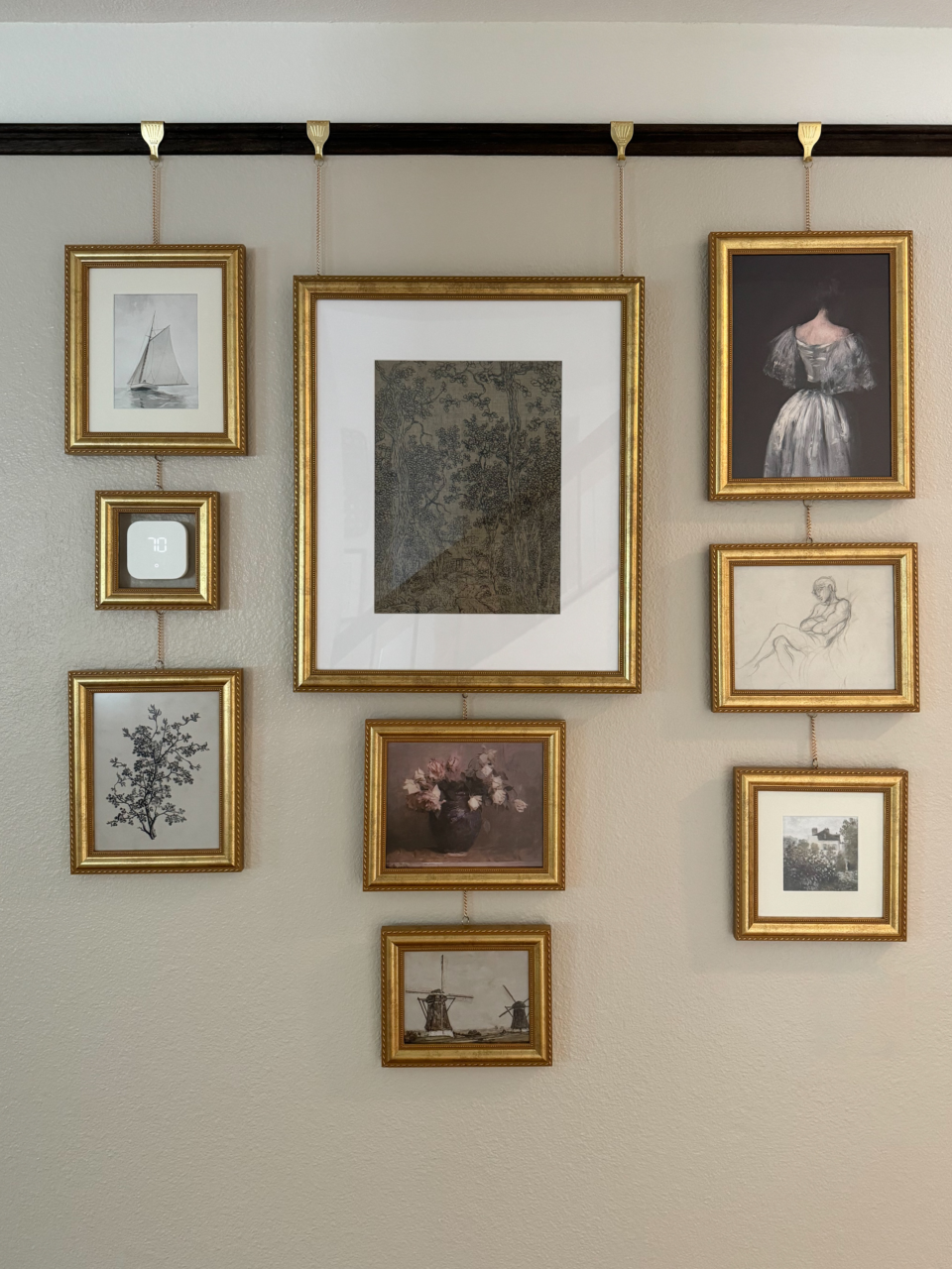 gold picture frames on gallery wall