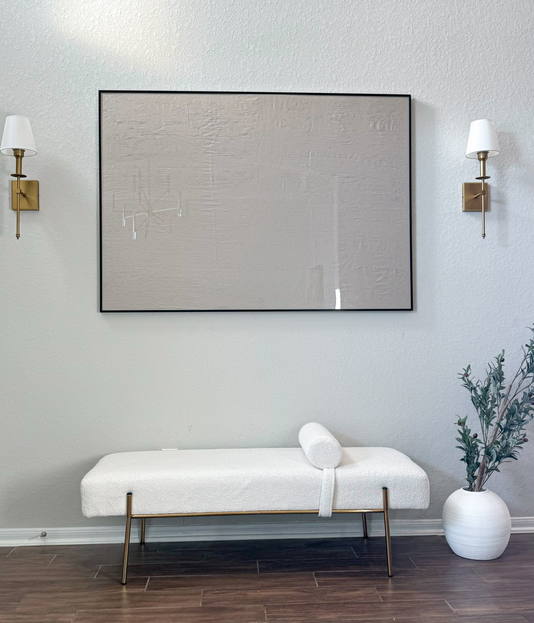 large artwork in black picture frame