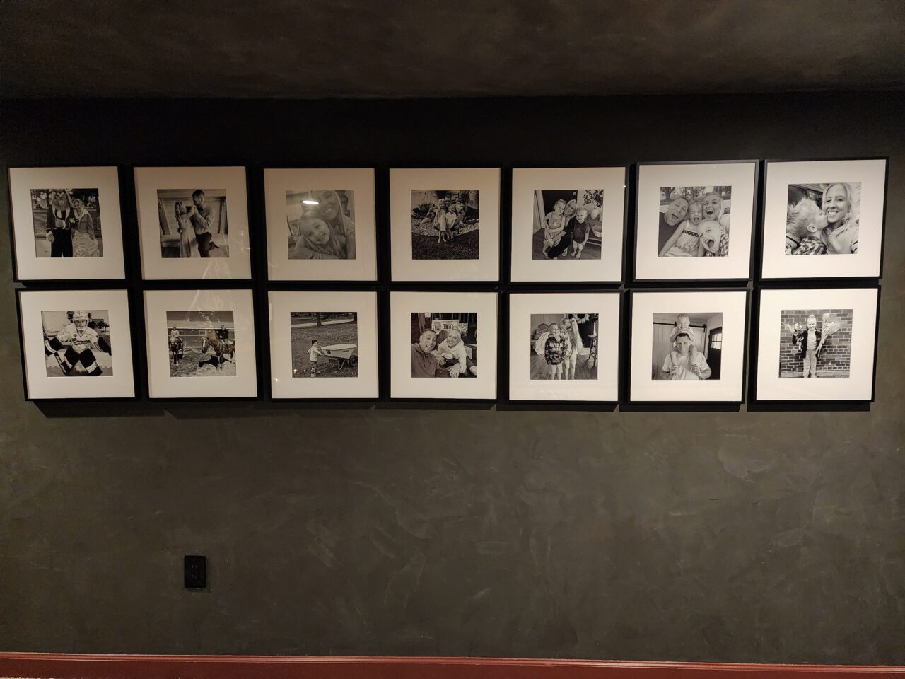 dark walls with black and white picture frames