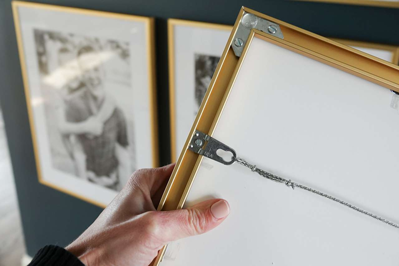 Gold picture frame with hanging hardware