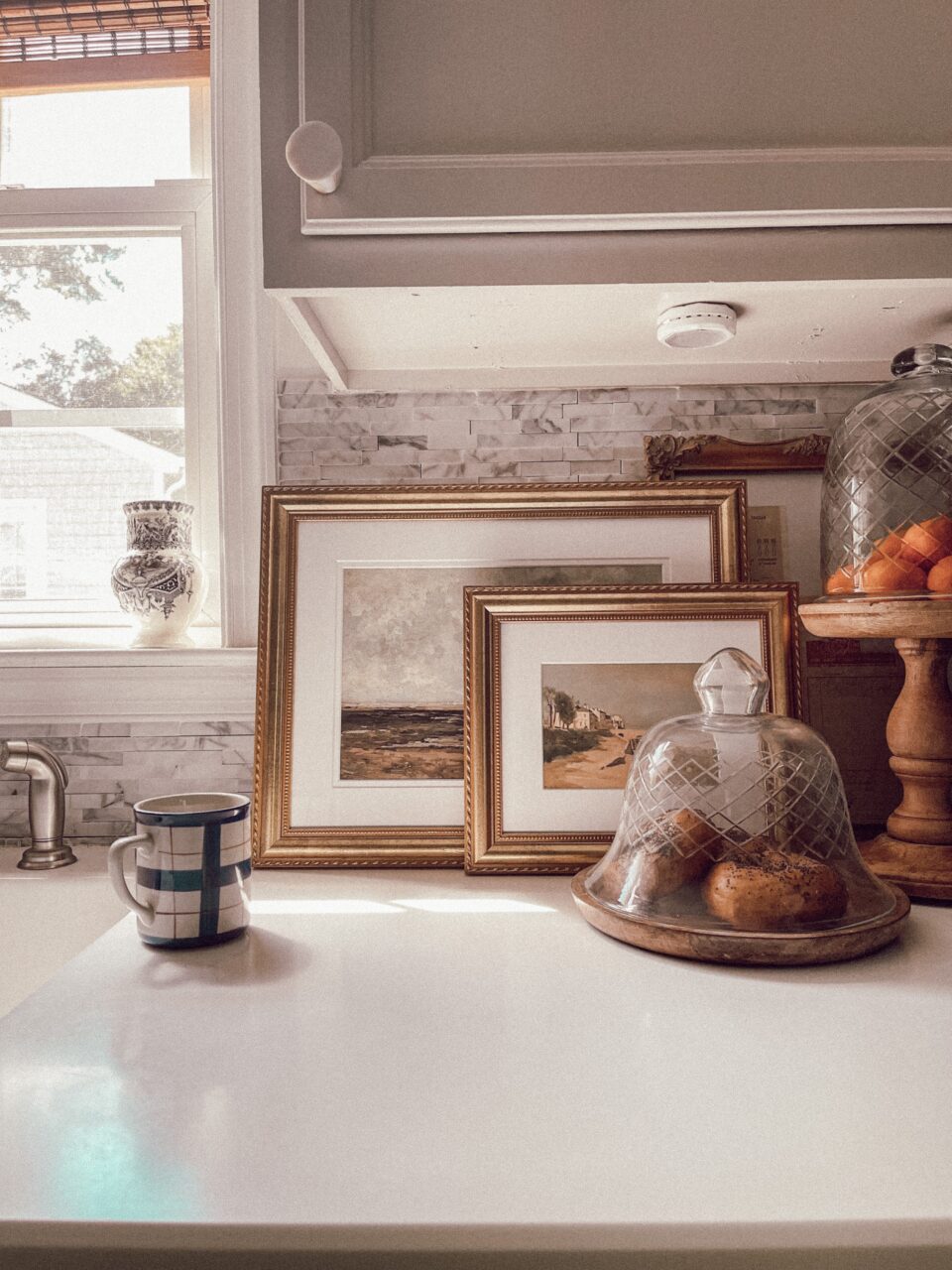 gold picture frames in the kitchen